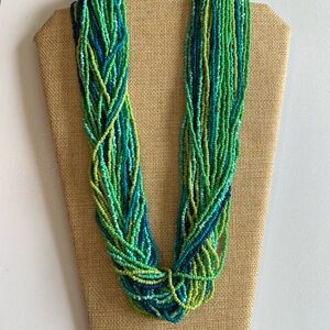 Striking seed bead necklace in ocean tones.